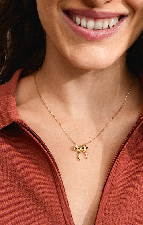 PILGRIM CASSIAN RECYCLED BOW PENDANT NECKLACE IN GOLD