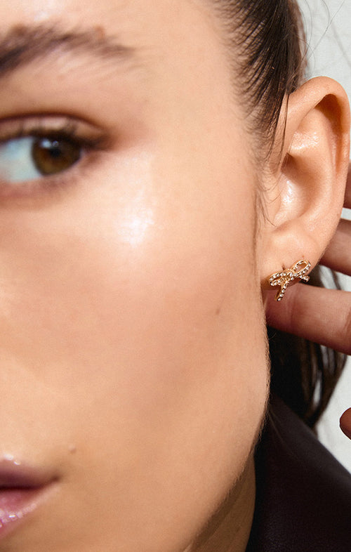 PILGRIM CATHARINA RECYCLED MICRO CRYSTAL BOW EARRINGS IN GOLD
