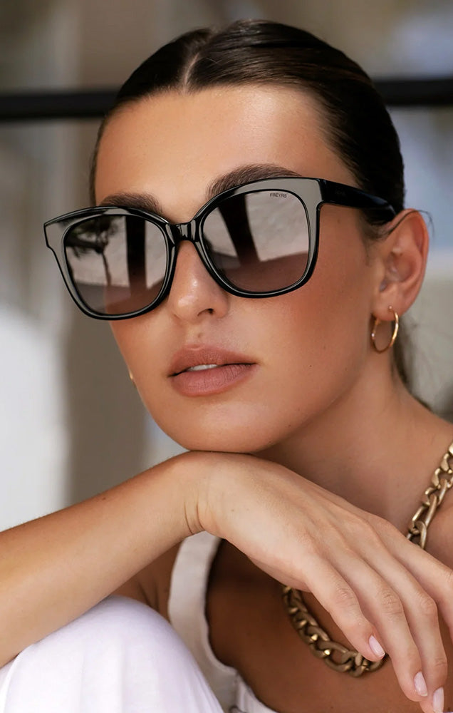 FREYRS AMBER SUNGLASSES IN BLACK NEEDS WANTS